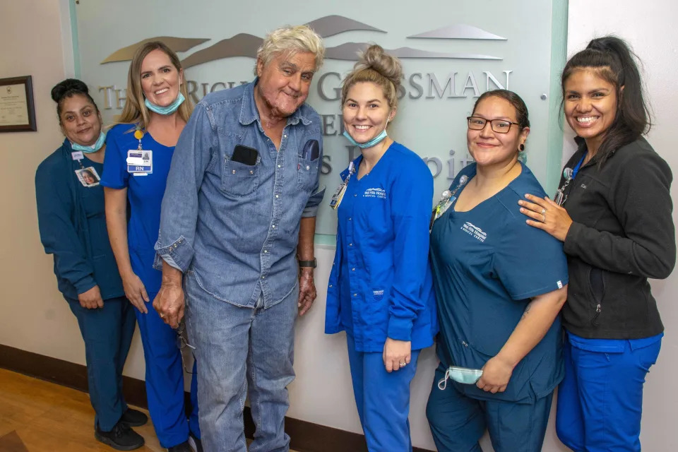 Jay Leno being released from the hospital after sustaining serious burns in a car fire