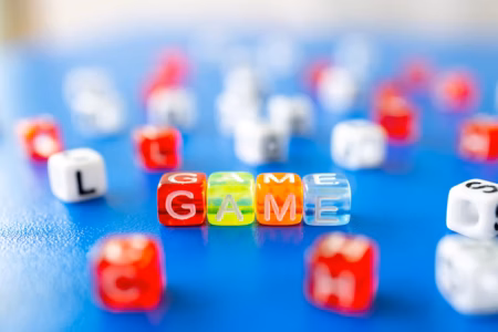 red white yellow and blue plastic dice